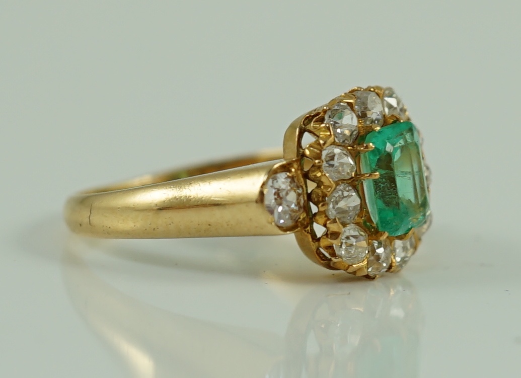 An 18ct gold, emerald and diamond octagonal cluster ring